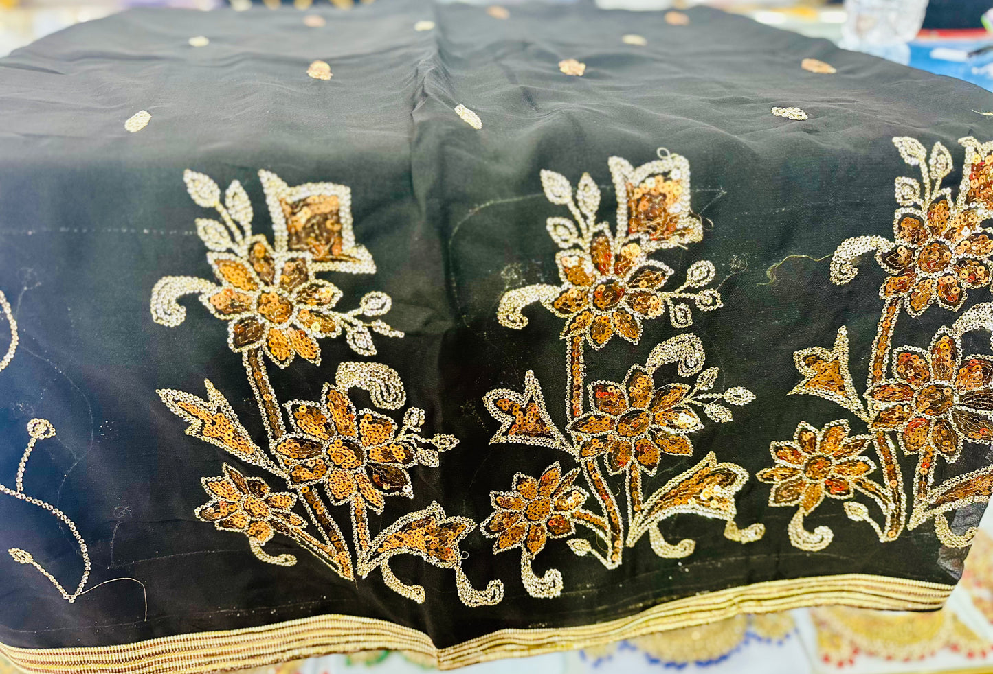 Black saree with gold sequence work